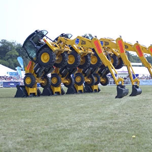 Stunt JCB diggers perfoming formation dance routine at New Forest show 2006