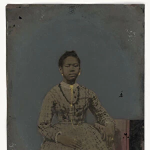 Tintype of a seated young woman, 1850-1875. Creator: Unknown