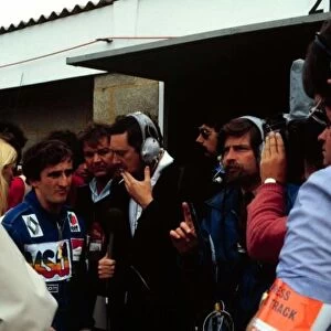 1981 BRITISH GP. Alain Prost is interviewed after securing 2nd on the grid at