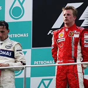 Formula One World Championship: Second placed Robert Kubica BMW Sauber F1 and race winner Kimi Raikkonen Ferrari on the podium