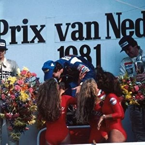 Formula One World Championship: Winner Alain Prost Renault recieves the spoils with Nelson Piquet Brabham second and Alan Jones Williams third