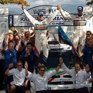 World Rally Championship: L-R: Michael Park and Markko Martin and the Ford Rally team, celebrate winning the rally