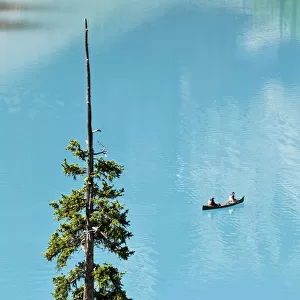 Canoeing On Turquoise Water Of Moraine Lake, Valley Of The Ten Peaks, Banff National Park, Alberta