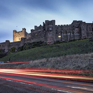 Light Trails On The Road And Bamburgh Castle; Bamburgh, Northumberland, England