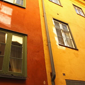 Low Angle View Of Red And Yellow Painted Buildings; Stockholm, Sweden