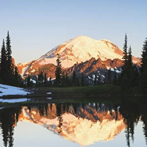 Mount rainier reflected in a pond at sunrise near tipsoo lake mount rainier national park; Washington united states of america