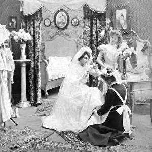 Stereoview Slide, a brides preparations on her wedding day preparing for the ceremony, circa 1900. A maid and friend helping the bride to dress