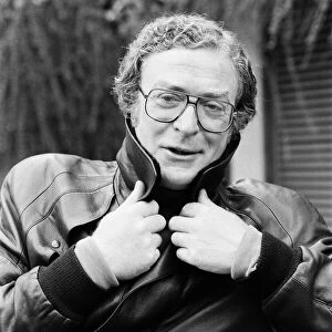 Actor Michael Caine poses wearing a leather jacket. 13th October 1987