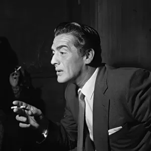 Actor Victor Mature in London to make the film "Interpol