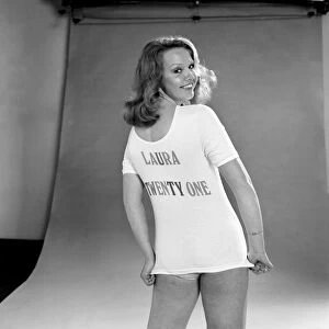Actress Laura Collins poses wearing a t shirt and pair of knickers in the studio