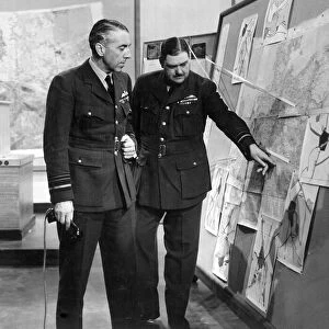 Air Marshal Sir Richard Peirse, Commander in Chief of RAF Bomber Command discussing a