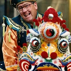 Andy Cameron comedian in traditional Chinese costume dragon mask star of The Adventures