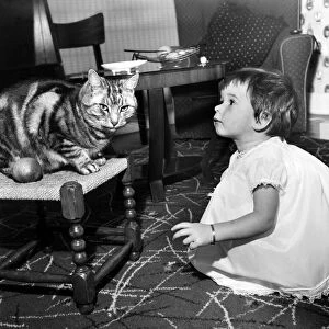 Baby and Cat: Karen at home with cats at the sink with nappies etc. November 1959 M4454