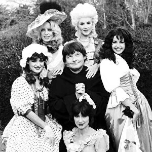 Benny Hill as a monk with girls during recording 1979 of his new show