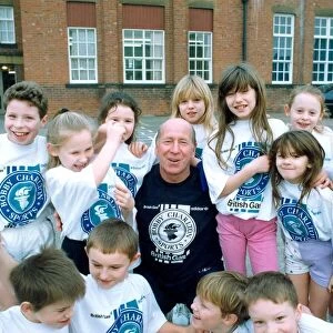 Bobby Charlton with children from Cavendish First School in Ashington in January 1992