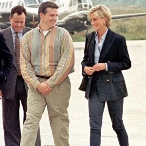 Britains Diana, Princess of Wales, right, meets mine victim Ken Rutherford center
