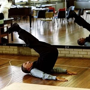 Bruce Forsyth TV Presenter and Comedian exercising in Gymnasium