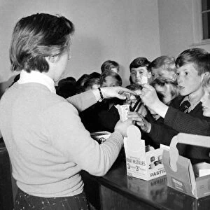Children buying sweets at the tuck shop at St Chads Cathedral School in Lichfield