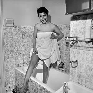 Domestic Life: Woman getting out of bath. 1957