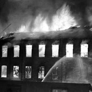 Flames leap from the roof of the mill during the height of the fire at Keighley, Bradford