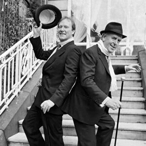 George Cole and Dennis Waterman at Minder photocall dancing on steps 04 / 12 / 1988