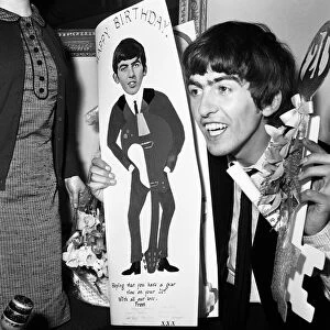 George Harrison, celebrating his 21st birthday. 25th February 1964