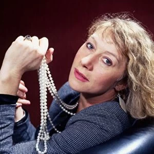 Helen Mirren holding pearls in hand May 1986