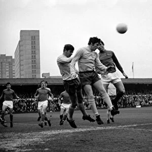Ipswich attack - Brown heads away a corn are kick. McNeil of Ipswich is in picture