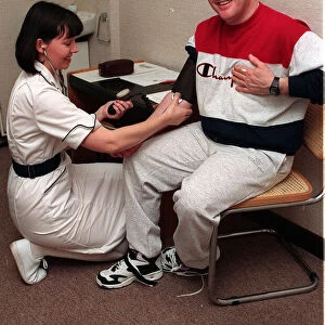 Keith Chegwin TV presenter at health farm January 1994 blood pressure being taken
