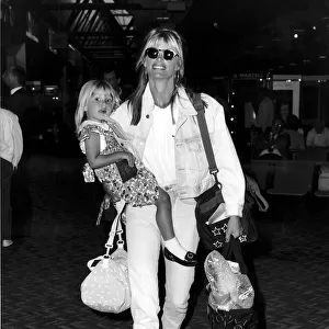 Kelly Emberg wife of Rod Stewart with daughter Ruby at Heathrow leaving for Los Angeles