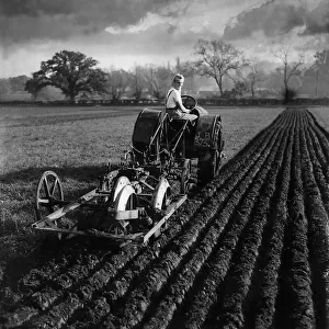 Land girl plowing field with tractor in Berkshire MSI WW2