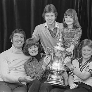 Laurie McMenemy with his wife and children holding the FA Cup at their home 14 / 2 / 77