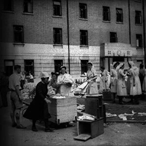 Lewisham Hospital after air Raid during WW2 1944 with nurses collecting some