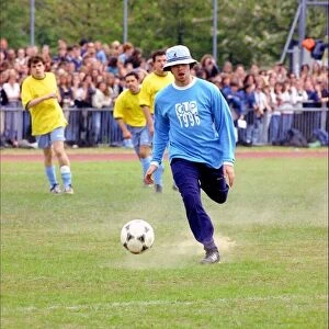 Liam Gallagher kicking football - May 1996 Oasis and Blur come head to head in