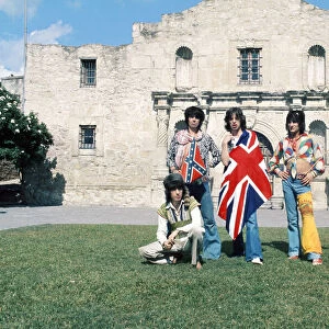 Mick Jagger (with Union Jack flag) and his Rolling Stones band stand at the famous Alamo
