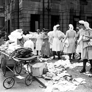 Nurses sorting linen outside Lewisham hospital after raid on the hospital the night