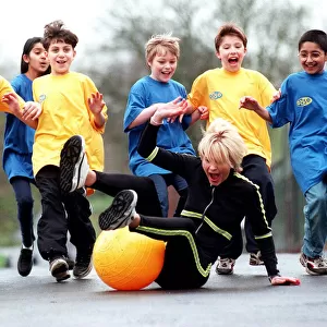 Sally Gray TV Presenter of the new 50 / 50 childrens show on a space hopper - March 1998
