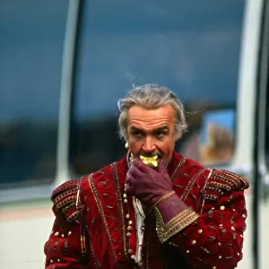 Sean Connery eating an apple on set of film Highlander in costume Circa May 1985