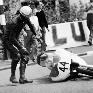 Senior TT race, Isle of Man. Alan Dugdale picks up his bike. 8th June 1964