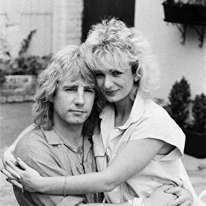 Status Quo band member Rick Parfitt and his new girlfriend Patty Beedon. 12th July 1985