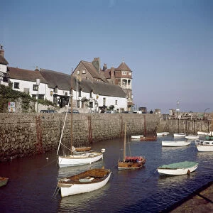 View of the town of Lynmouth on the North Devon coast, showing boats moored in