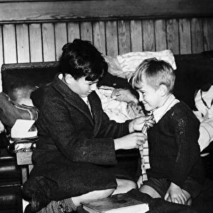 World War Two 1940 Evacuee boy gets a helping hand from his elder brother