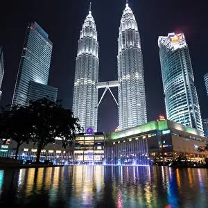KUALA LUMPUR, MALAYSIA - April 16, 2016: Petronas Twin Towers with Musical fountain at night in Kuala Lumpur, Malaysia