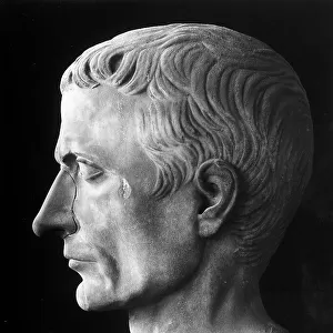 Profile of the head of the Roman emperor Julius Caesar. Sculptural work from the Roman age, preserved in Pisa Cemetery