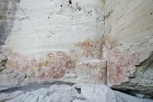 Aboriginal rock art, stencil art dated circa 2000 years old, showing depictions of hands, boomerangs