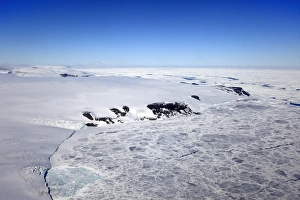 Aerial Prints: Aerial view of pack ice and coastline