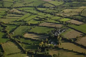 Aerial Prints: Aerial view of pasture and meadows with hedgerows farm buildings and cattle