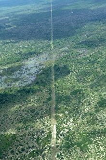 Game Prints: Aerial view of wildlife fence at edge of reserve, Okavango Delta, Botswana