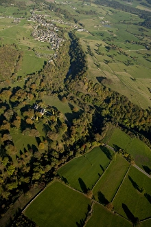 Aerial Prints: Aerial view of wooded valley, farmland and village