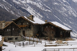 Alpine houses covered in snow, Gran Paradiso N. P. Graian Alps, Italian Alps, Italy, january